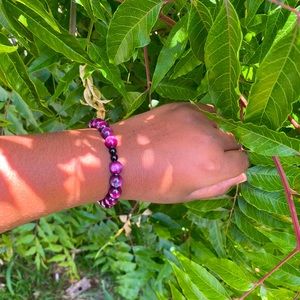 purple bead rock, with 2 obsidians in the middle